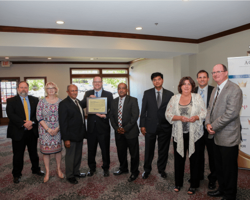 Staff photo with award